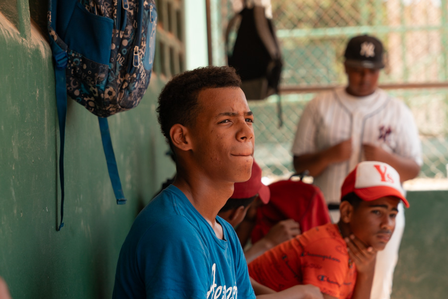 Empower Baseball student watching a game in the Dominican Republic